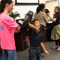 photo of boy punching bag