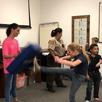 photo of girl punching bag