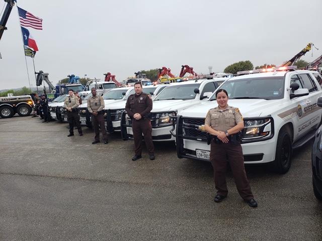 photo of deputies standing in front of their patrol cars