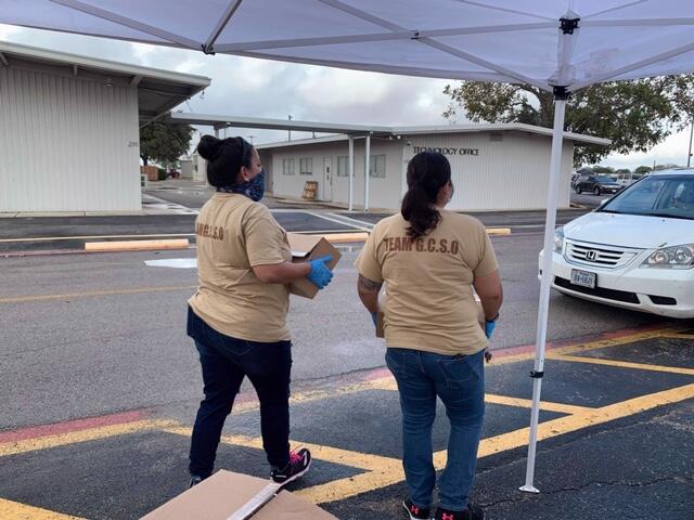 photo of deputies holding boxes