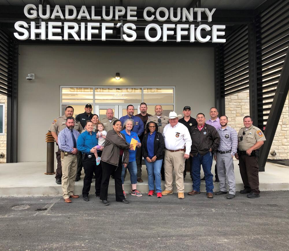 photo of officers in front of GCSO building