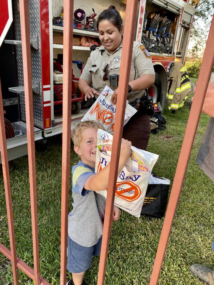 Little boy with Deputy Pinilla