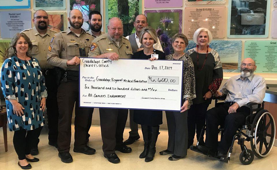 Deputies giving large check to Foundation memebers